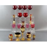 Six large ruby wine glasses, 18 cm together with four cranberry wine glasses, 12 cm and gilt