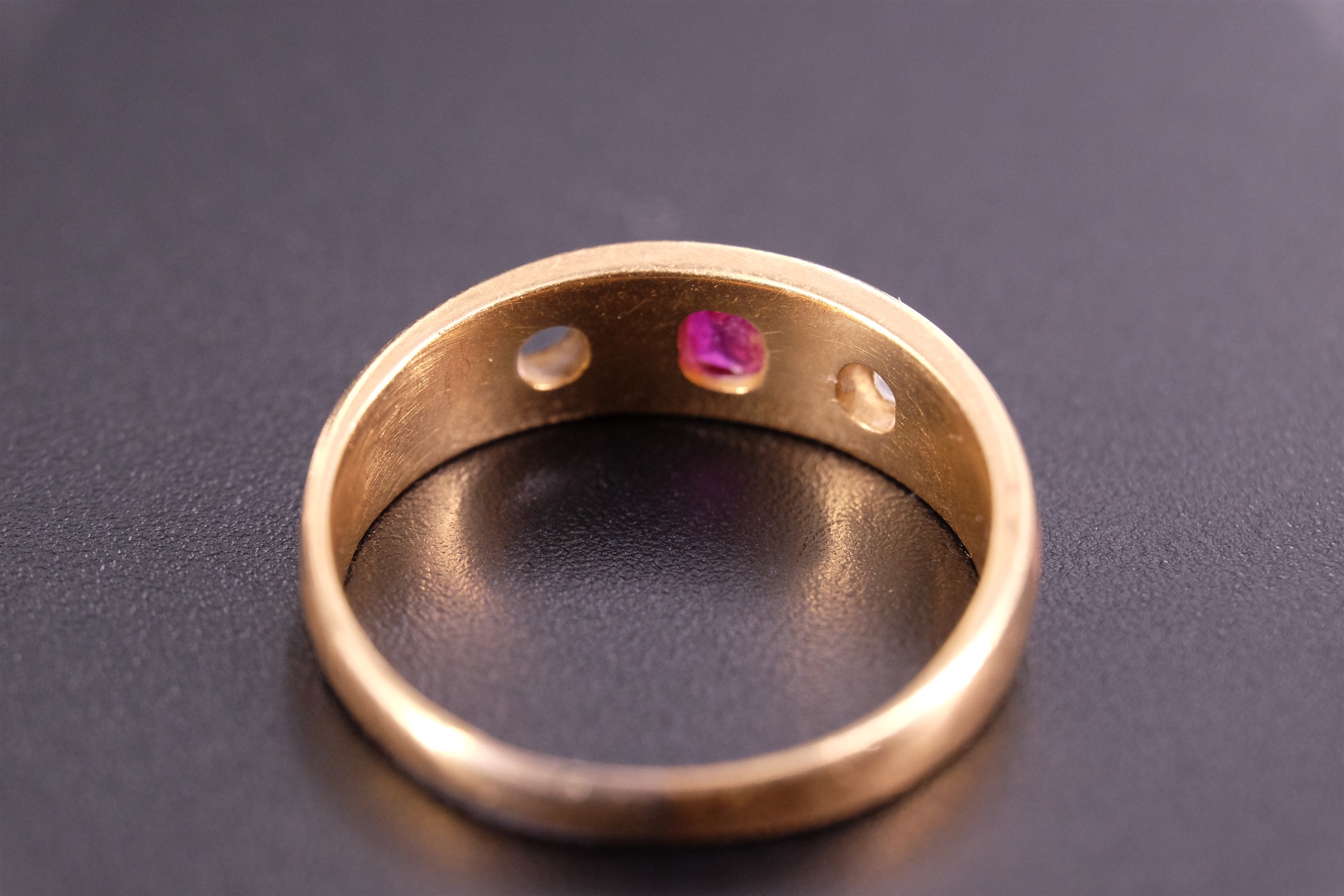 An 18 ct yellow metal, diamond and pink stone finger ring, the stones sunken set on a broad tapering - Image 3 of 4