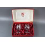 A boxed pair of Cristallerie Zwiesel Tawny Owl "Hand Engraved Crystal" glasses, by Bruce Walker,