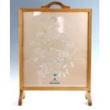 A 1950s embroidered fire screen, 50.5 x 21 x 72 cm