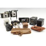 A group of vintage Kodak cameras and accessories, including a No 2 Folding Cartridge Premo, a