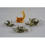 Three Bimini type glass lamp-work mice together with a similar fish, 4 cm tallest