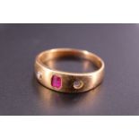 An 18 ct yellow metal, diamond and pink stone finger ring, the stones sunken set on a broad tapering