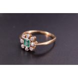 An early 20th Century emerald and diamond finger ring, comprising a central cushion-cut stone
