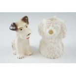 A Sylvac terrier dog figurine together with a novelty milk jug in the form of an open-mouthed dog,