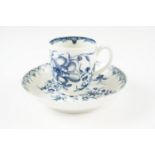 An 18th Century Worcester teacup and saucer in the Peony pattern, decorated with flora and