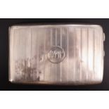 A George V engine turned silver cigarette case, gilt lined, bearing an engraved monogram, Chester,