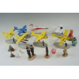 A collection of The Adventures of Tintin figurines and collectables, including aircraft, "The Moon