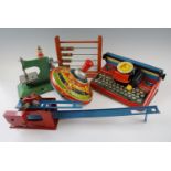 A group of vintage children's toys, including a Mettype typewriter, a Chad Valley tinplate "Choral