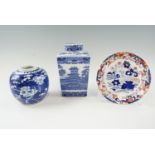 A Rington's blue and white tea caddy together with a Prunus pattern ginger jar and an Amherst dish