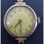 A 1920s lady's 9 ct gold wristlet watch, having a yellow metal flexible bracelet strap, (a/f), 6.2 g