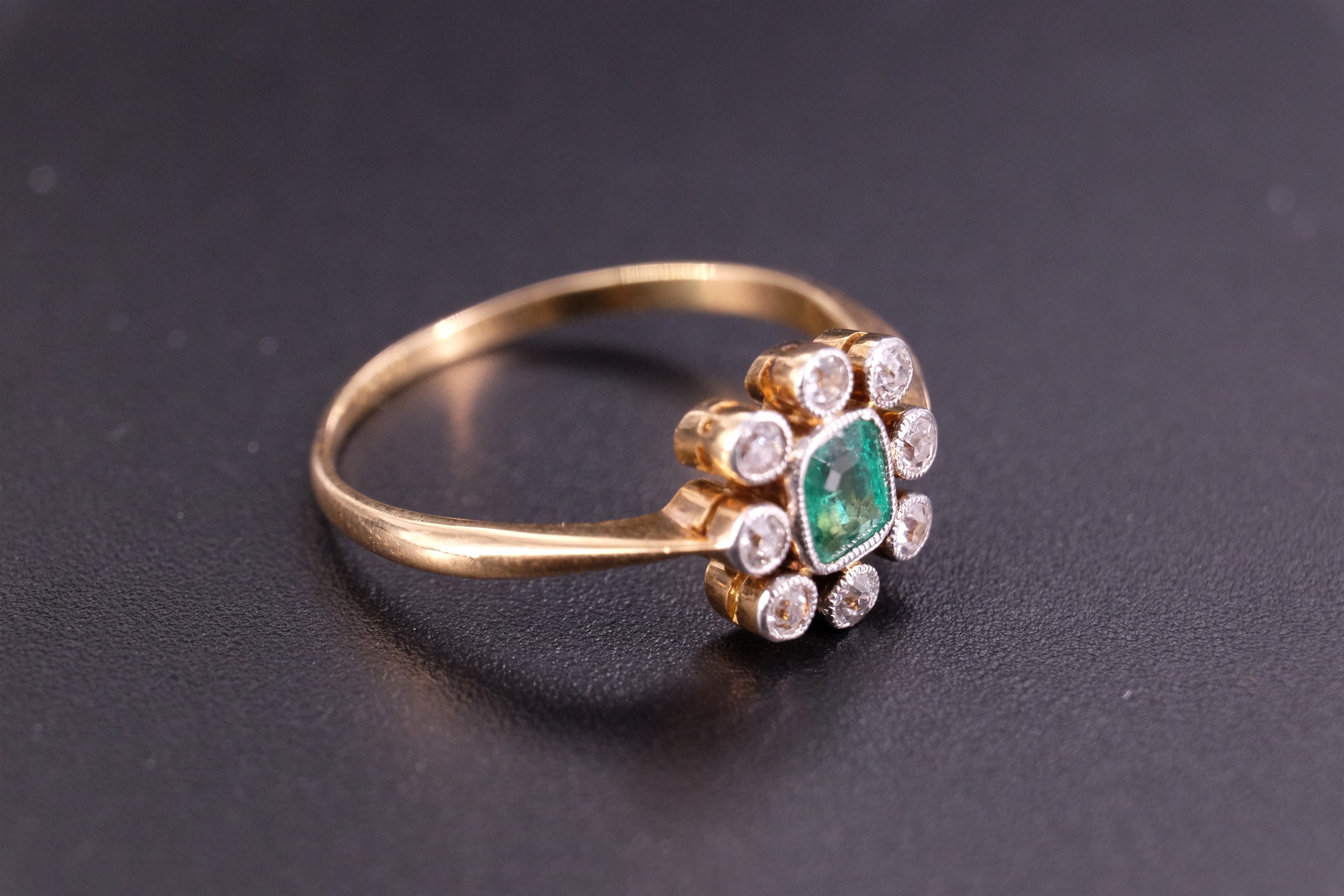 An early 20th Century emerald and diamond finger ring, comprising a central cushion-cut stone - Image 3 of 6