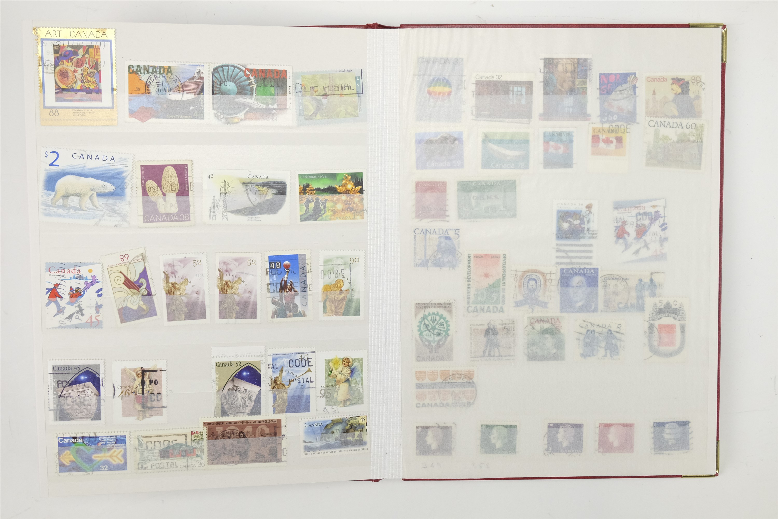 Three hingeless albums containing a collection of USA and Canadian stamps together with a quantity - Image 8 of 47