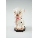 A Royal Worcester Bonzo dog pepperette, designed by Frederick Gestner in 1929, shape number 2855,