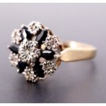 A late 20th Century sapphire and diamond flowerhead cluster ring, comprising an open arrangement
