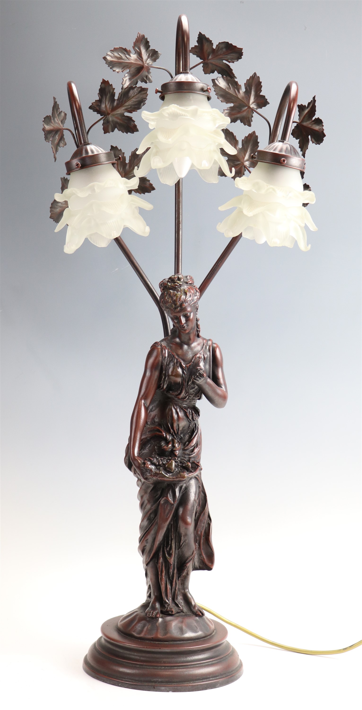A late 20th Century cold cast resin figural lamp, 83 cm