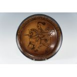 A Poole "Aegean" charger depicting Knight on horseback, signed "J.W", 32 cm