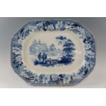 An early 19th Century underglaze blue ashet, decorated with a scene of a family and dog before a