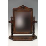 A stained pine swivel toilet mirror, 64 x 54 x 16 cm