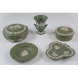A small group of Wedgwood green Jasperware, including two lidded pots, an ashtray, etc, tallest 8.