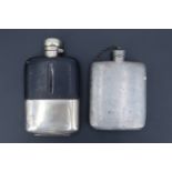 An early 20th Century electroplate-mounted hip flask, in glass, its leather covered shoulders having