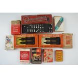 A group of vintage games, comprising playing cards, dominoes and "Milbro-Club" darts