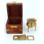 A brass chart / map magnifying glass, in a brass bound wooden box, together with another similar,