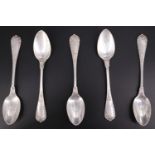 A set of five early 20th Century white metal teaspoons, having cast floral and scroll decoration,