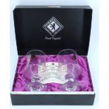 A boxed pair of Edinburgh International lead crystal "Theakston's 1982 Christmas Goblets", 15 cm