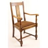A George V oak open armchair