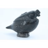 A pre-Columbian Chimu blackware vessel in the form of a bird clutching a snake in its claws, 15 cm x