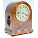 An early 20th Century burr walnut veneered mantle clock, retailed by Spiridion & Son of Cardiff,