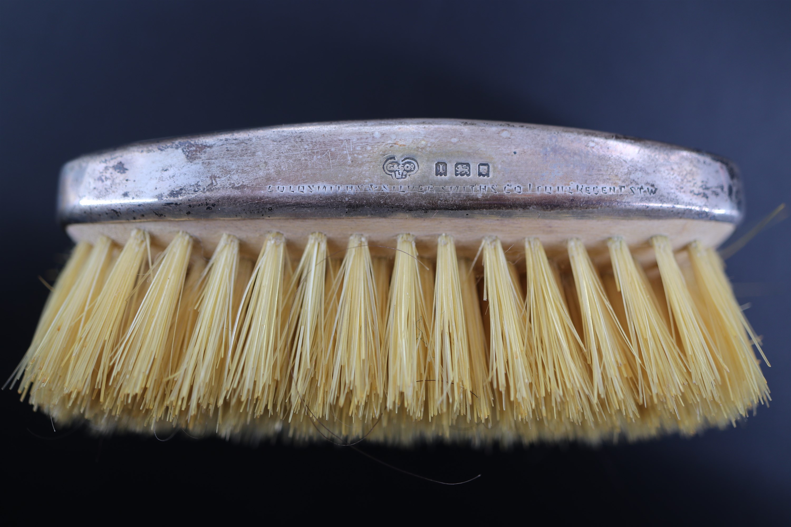 A 1920s silver mounted brush in The Goldsmiths & Silversmiths Company Ltd travel case, the brush - Image 5 of 5
