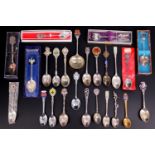 A collection of souvenir electroplate spoons