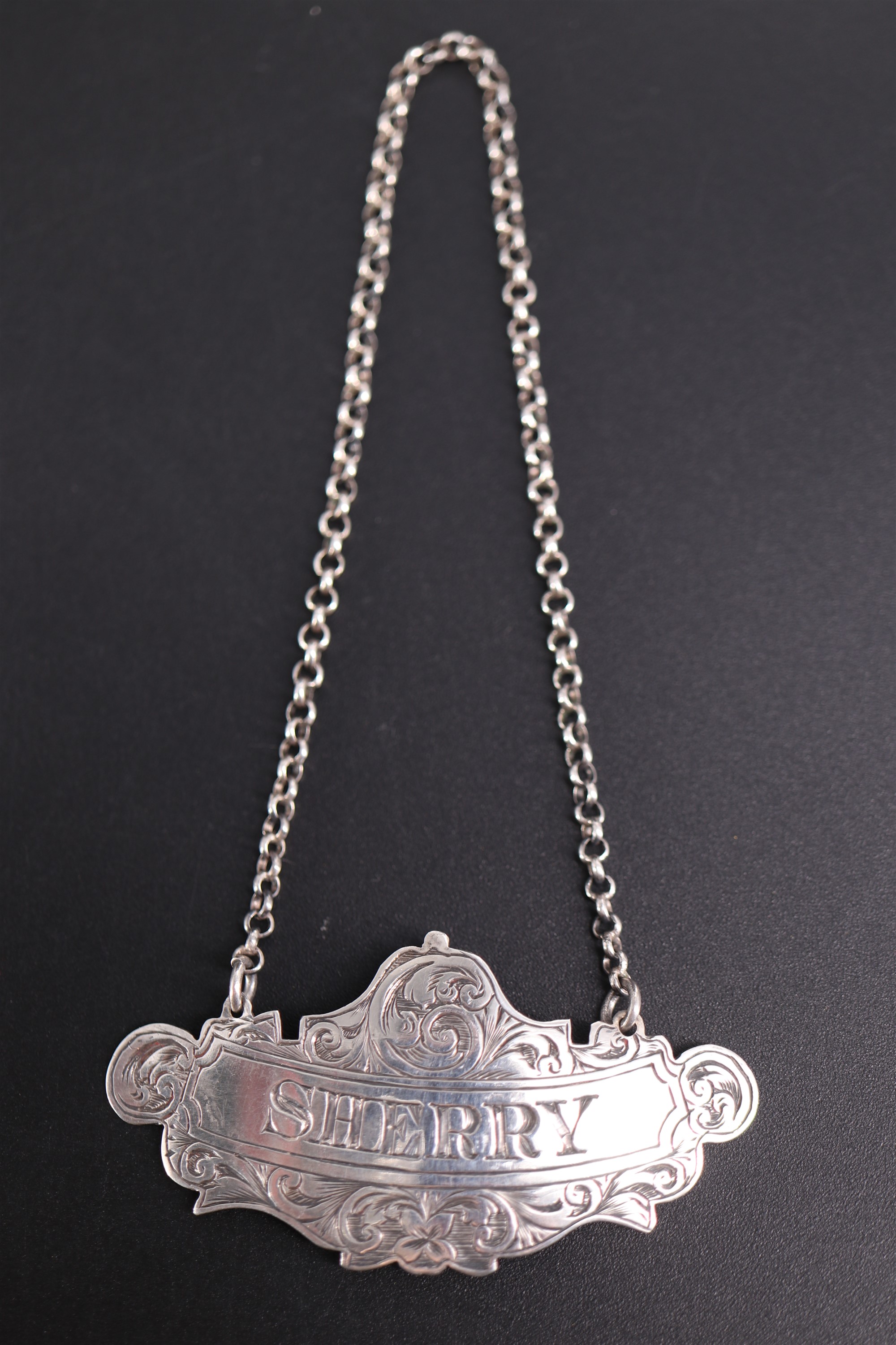 A Victorian silver Sherry decanter label, George Unite, Birmingham, 1865, 6 cm