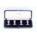 An Edwardian cased set of four novelty silver menu holders / place markers by Sampson Mordan,