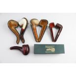 Three cased vintage Meerschaum pipes, together with a cased silver mounted walnut pipe, and an Irish