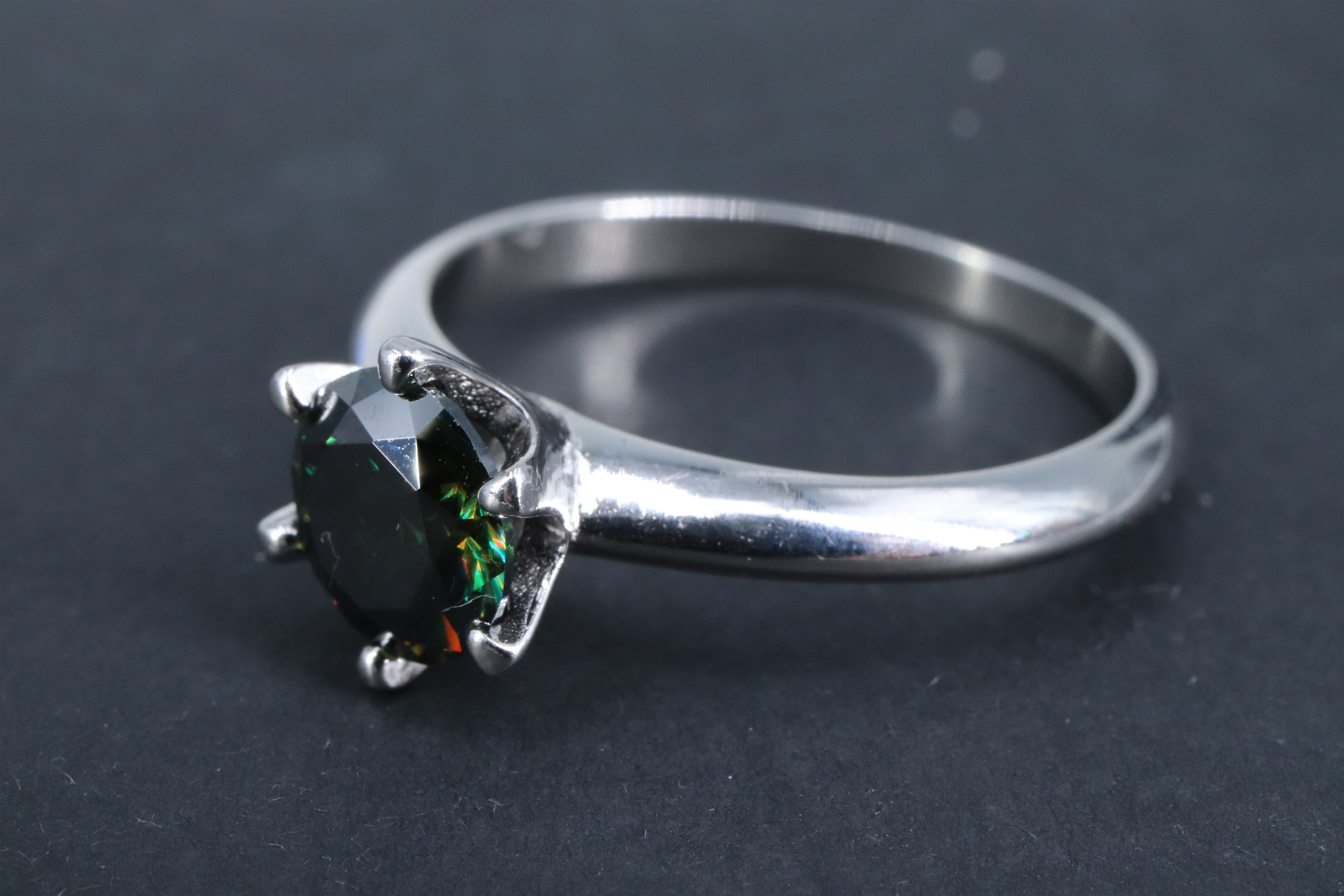 A modern green Moissanite solitaire ring, having a one carat brilliant crown set between tapering - Image 2 of 3