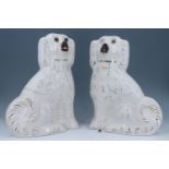 A pair of large early 20th Century Staffordshire dogs, having glass eyes, 32 cm, (a/f)