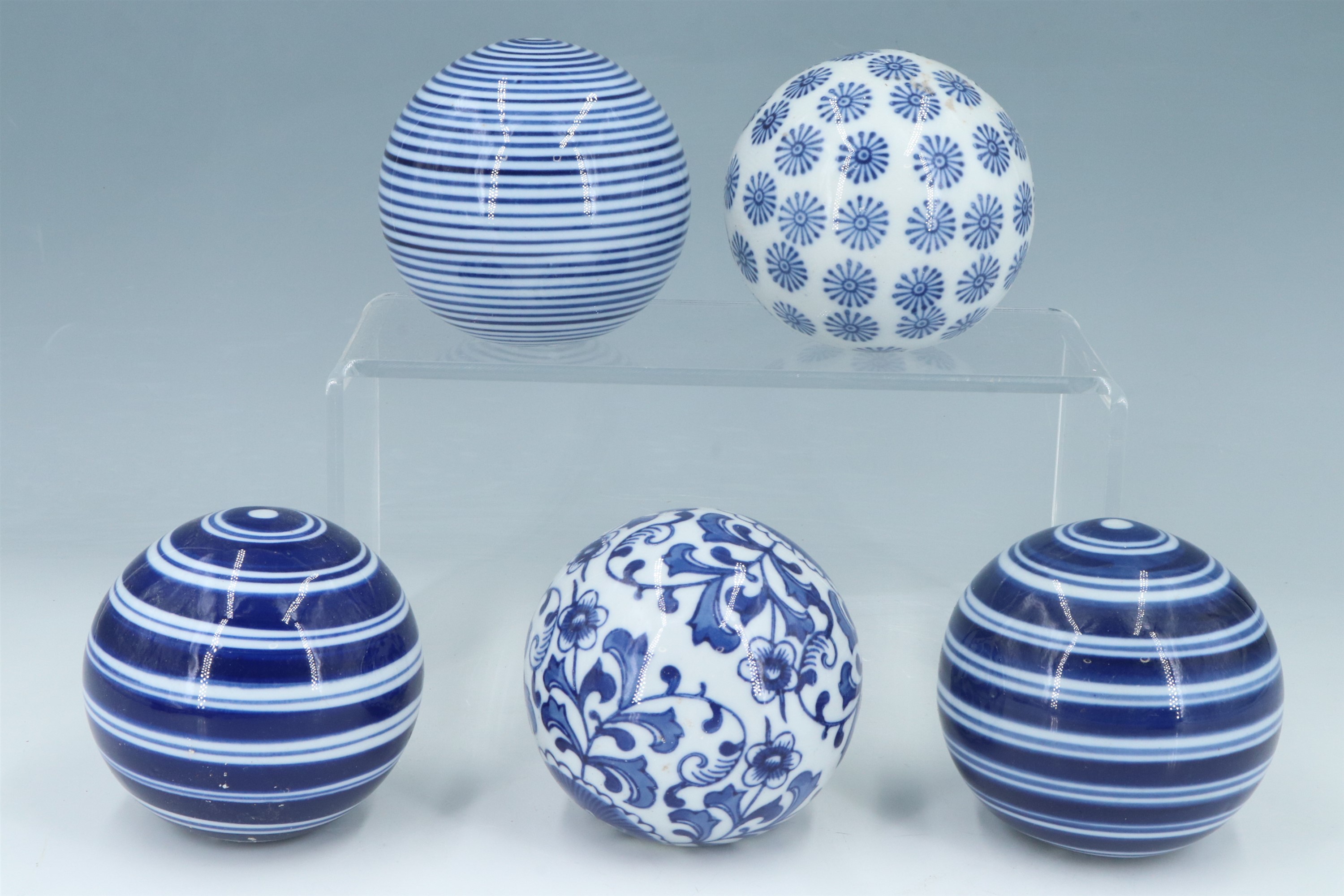 Five modern reproduction Scottish blue and white ceramic carpet bowls