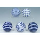 Five modern reproduction Scottish blue and white ceramic carpet bowls