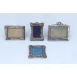 Four early 20th Century and later diminutive silver faced photograph frames, comprising oblong