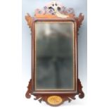An old reproduction 18th Century mahogany fret mirror, having pierced fret-work and parcel gilt ho-