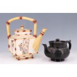 A Victorian majolica teapot, having a faux bamboo handle and spout, the square body having