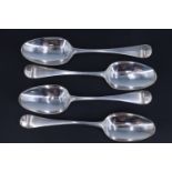 A set of four George IV silver Old English pattern table spoons, bearing engraved crests to the