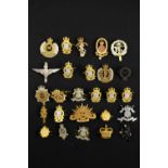 A group of post-1952 British army cap badges etc