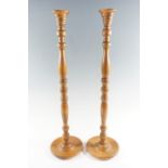 A pair of late 20th Century turned pine candle stands, 66 cm