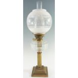 A Victorian and later columnar brass and glass oil lamp, having a duplex coronet burner and later