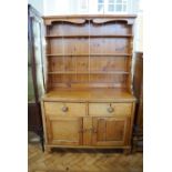 A Victorian and later pine kitchen dresser, 111 cm x 171 cm high