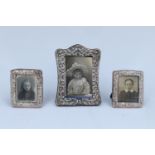 A small Edwardian silver-faced photograph frame together with a smaller electroplate pair, former